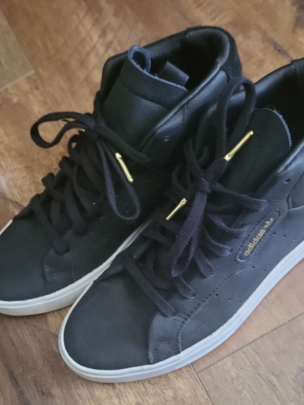 Adidas "Slick" Black High tops. Size 8